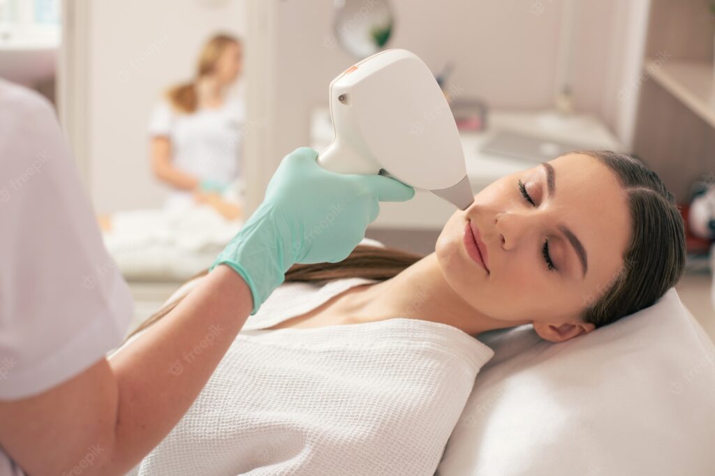 Close-up of a young woman undergoing advanced laser hair removal by a professional cosmetician for skin rejuvenation, best laser treatment near me.